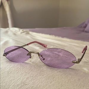 This is a pair of metal purple oval frame glasses.